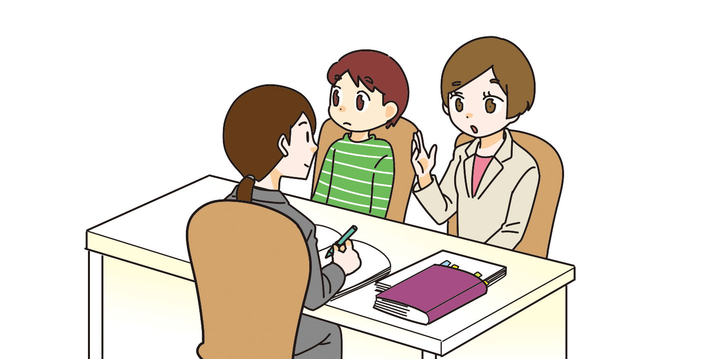 専門家に自分の子供について相談する親