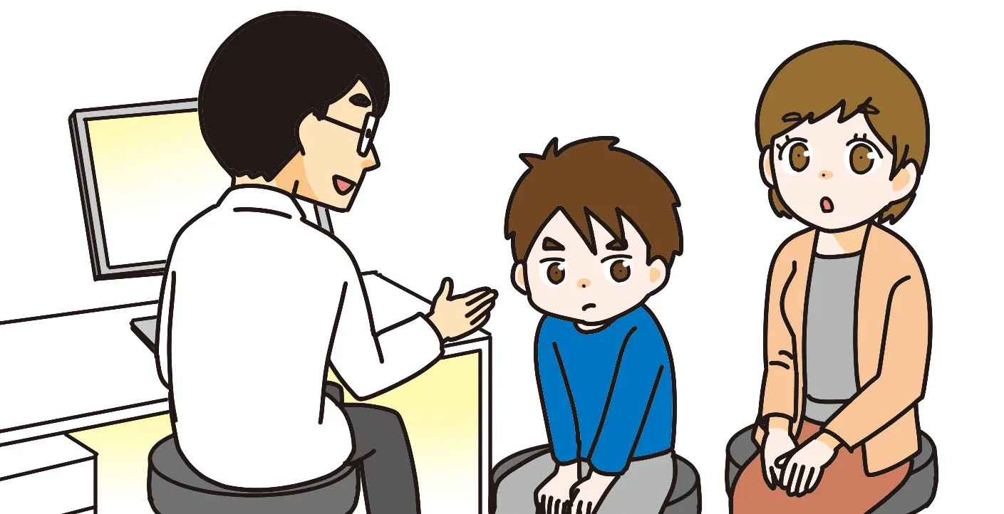 病院で話をする先生と聞いている親子